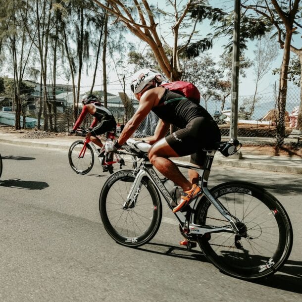 three cyclists on road