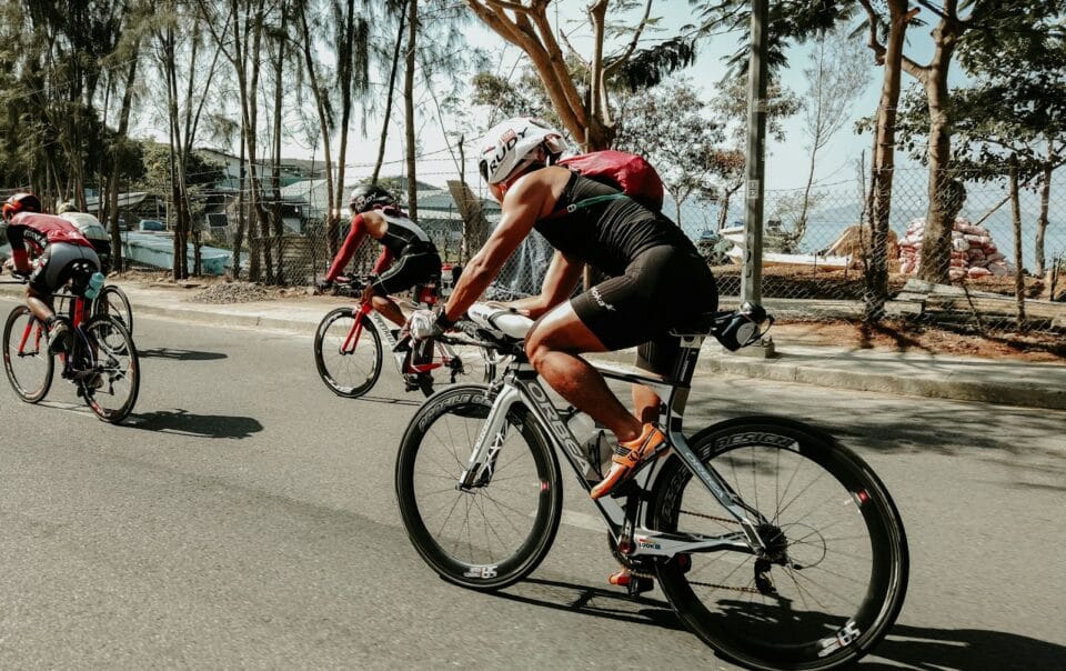three cyclists on road