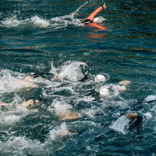 people swimming during day