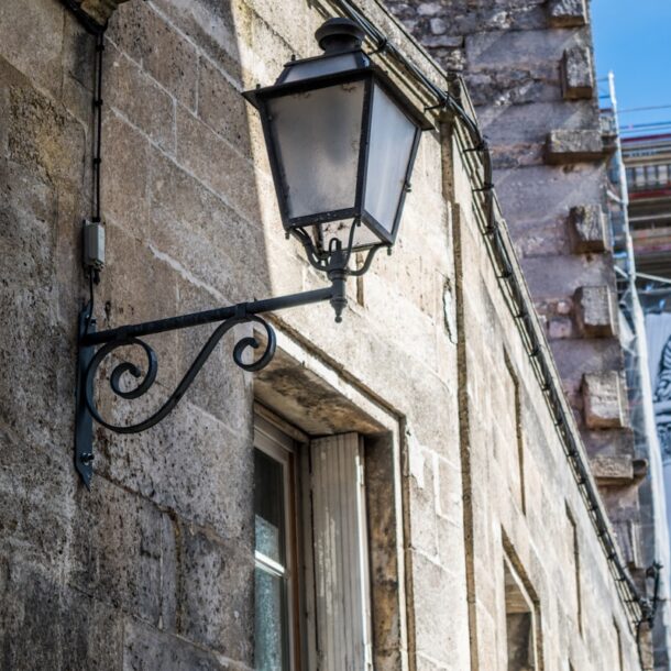 a street light on the side of a building